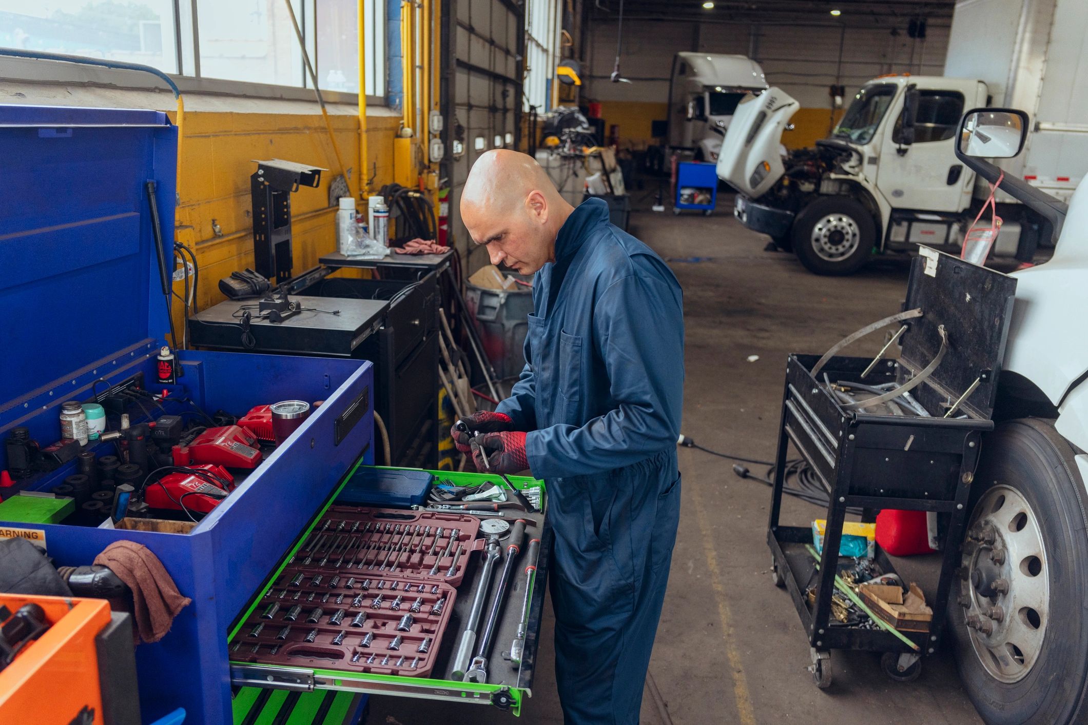 Technician preparing tools for industrial equipment repair